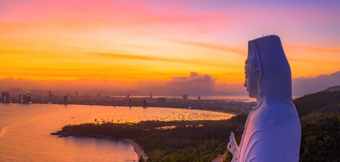 Lady Buddha statue overlooking Da Nang at sunset