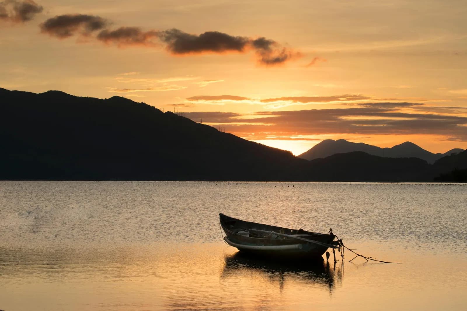 Boat on Lang Co Lagoon at sunset