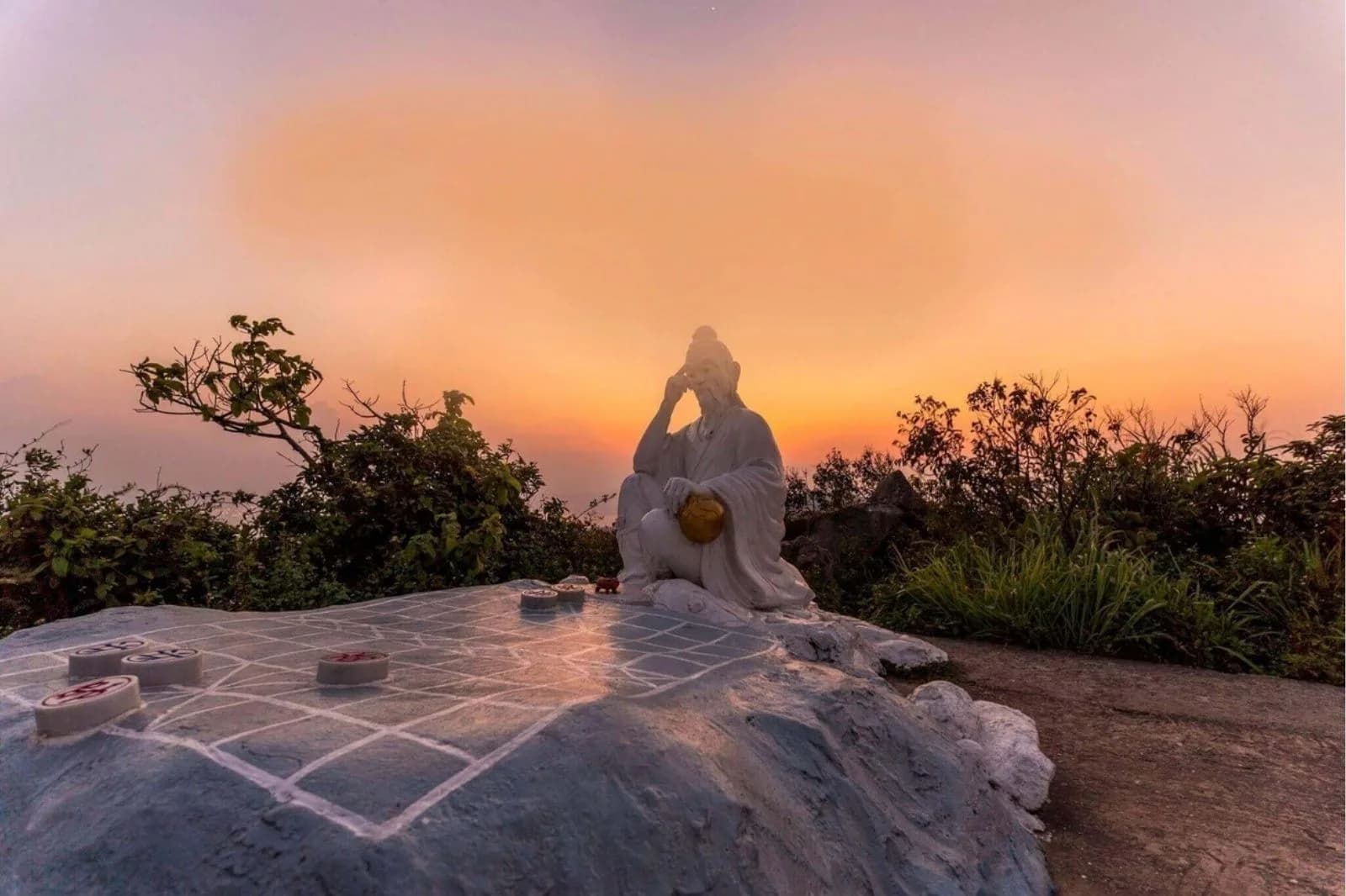 Chess King statue at Ban Co Peak at golden hour