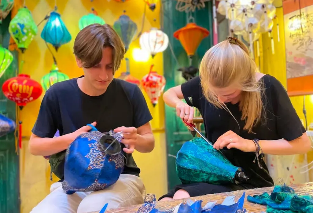 Travelers learning lantern making in Hoi An