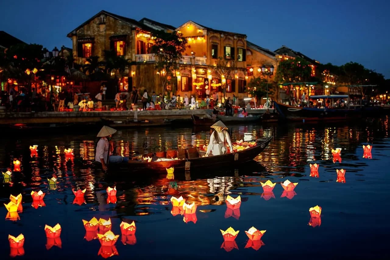 Lanterns floating on the Thu Bon River at night