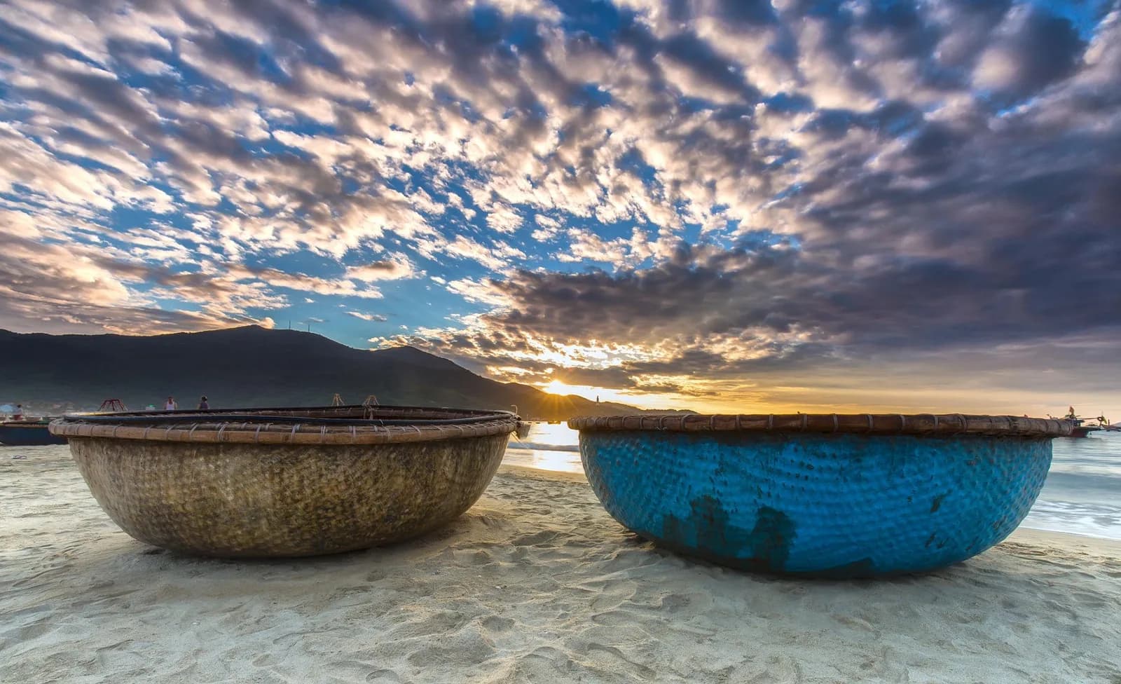 Traditional Vietnamese basket boats at dawn