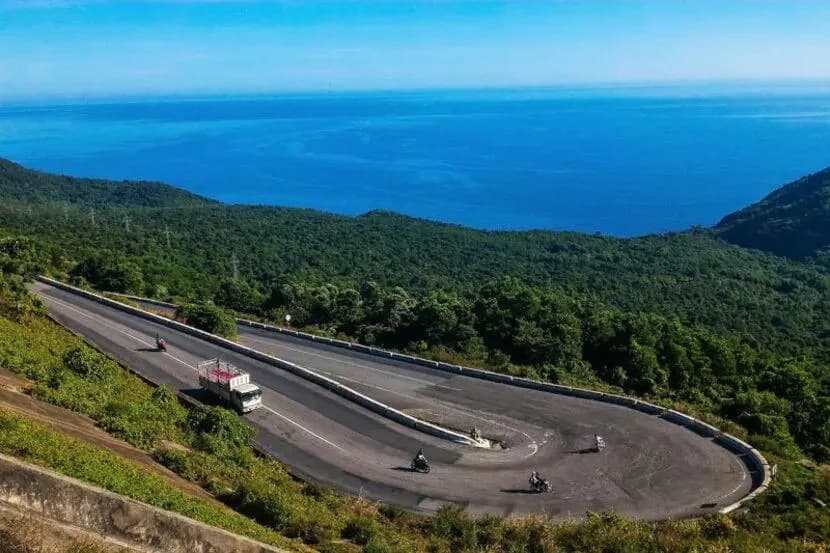 Winding road of Hai Van Pass with motorbikes