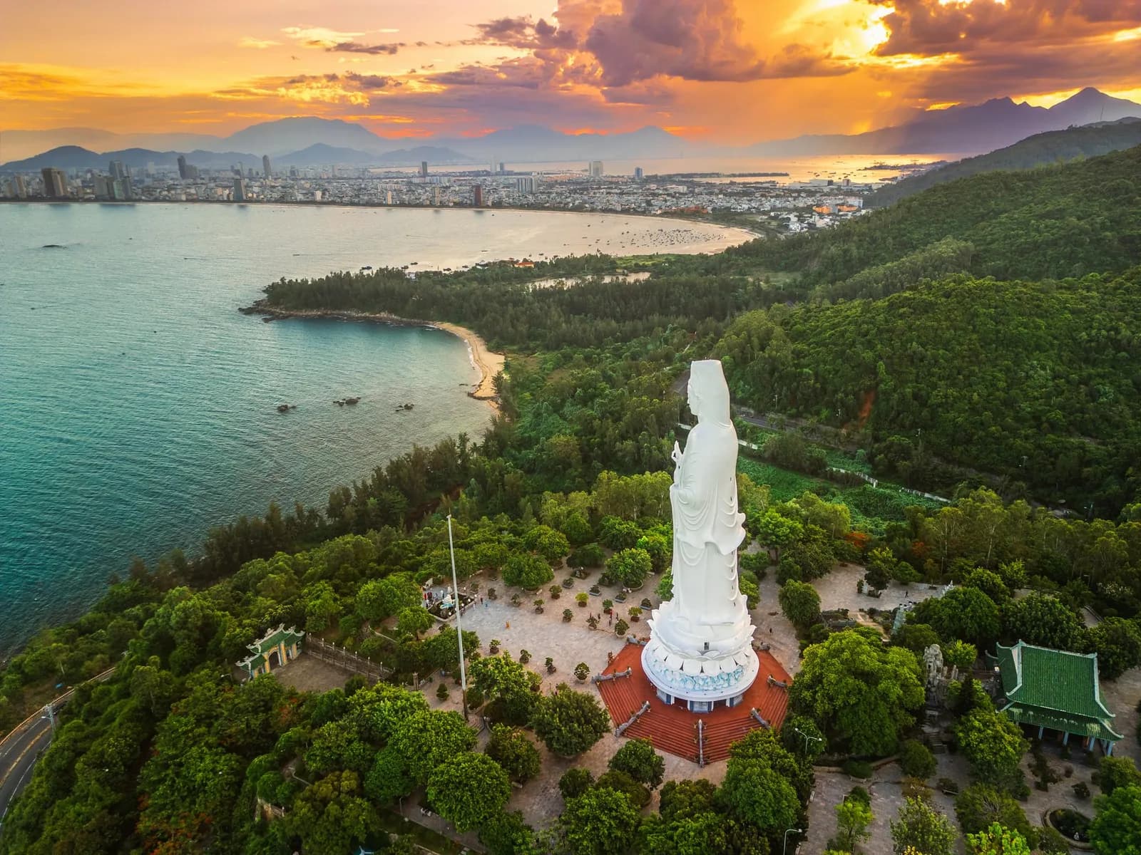 Lady Buddha statue from above at sunset