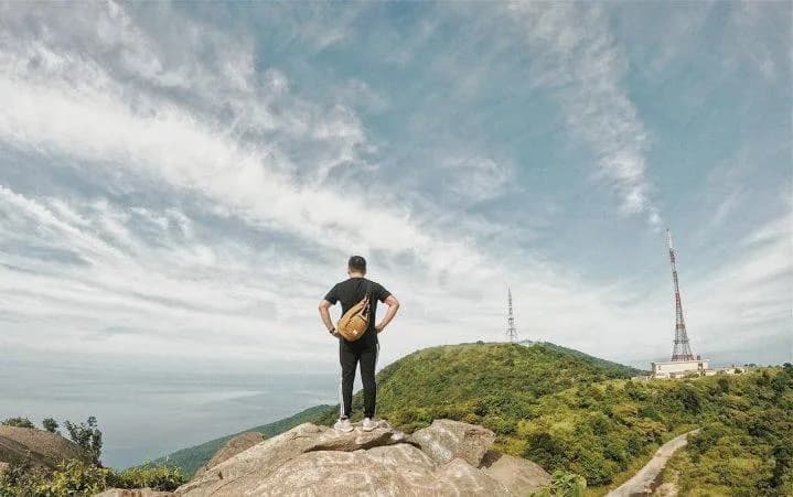 Hiker on rocks at Ban Co Peak