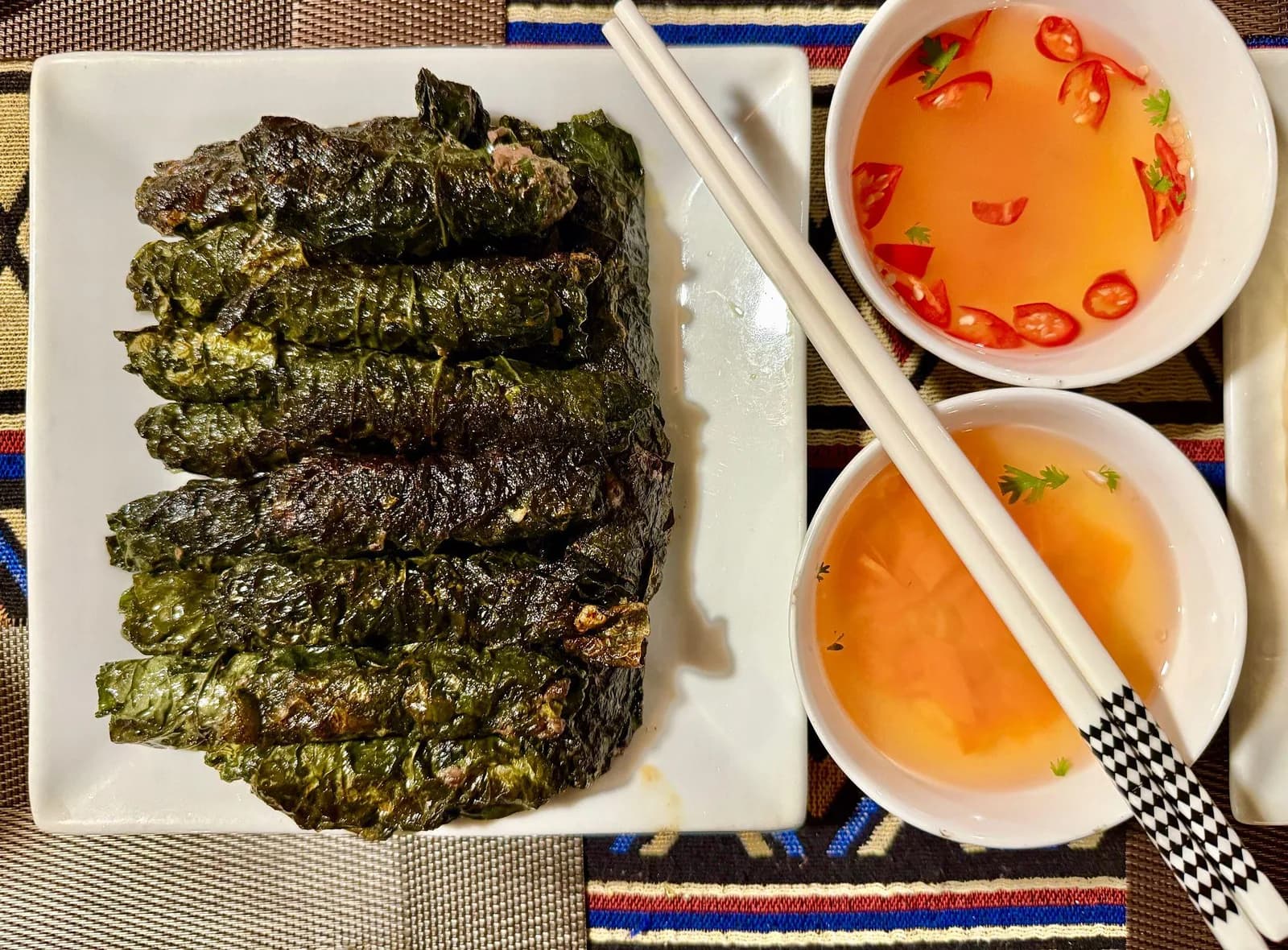 Beef wrapped in betel leaves with dipping sauce